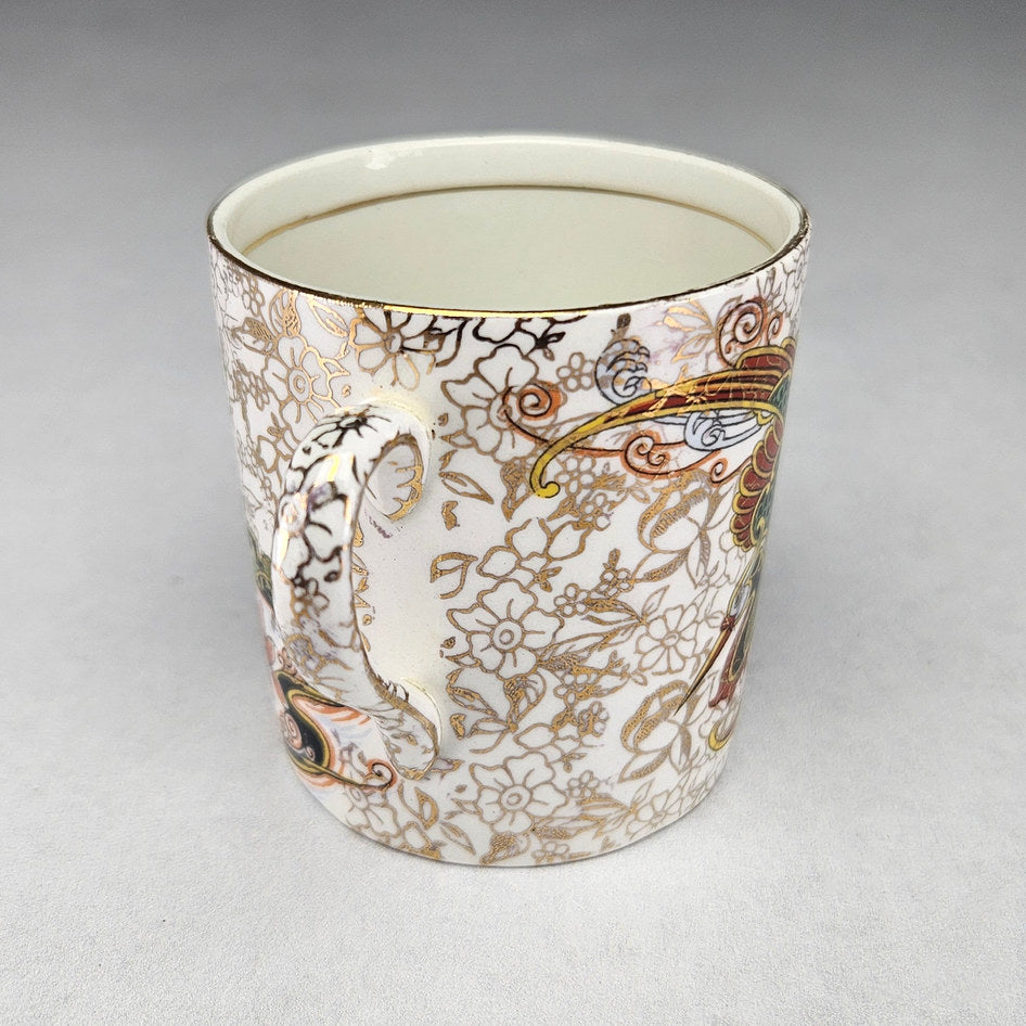 Phoenix Ware cup showing red and green dragon decoration